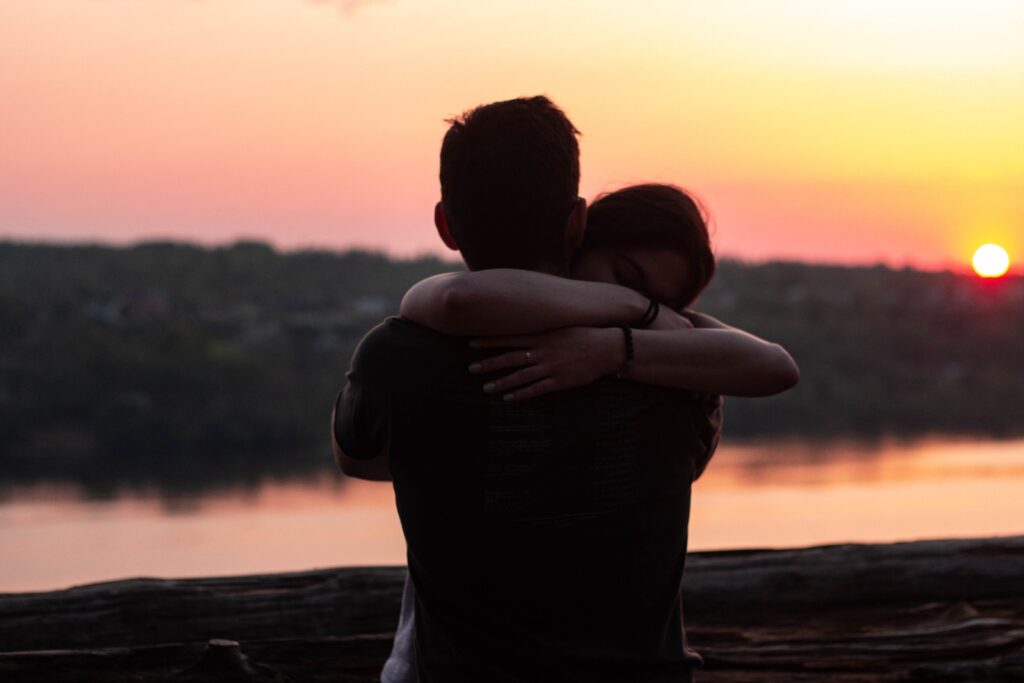 couple hugging each other during sunset with gratitude