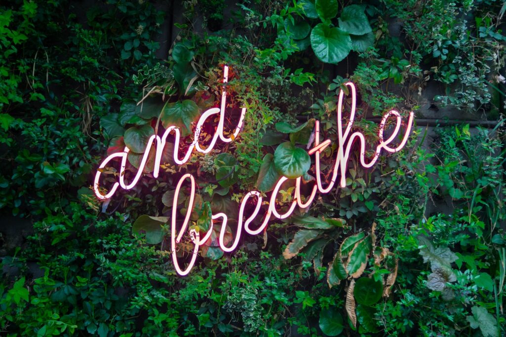 and breathe neon sign to feel less triggered